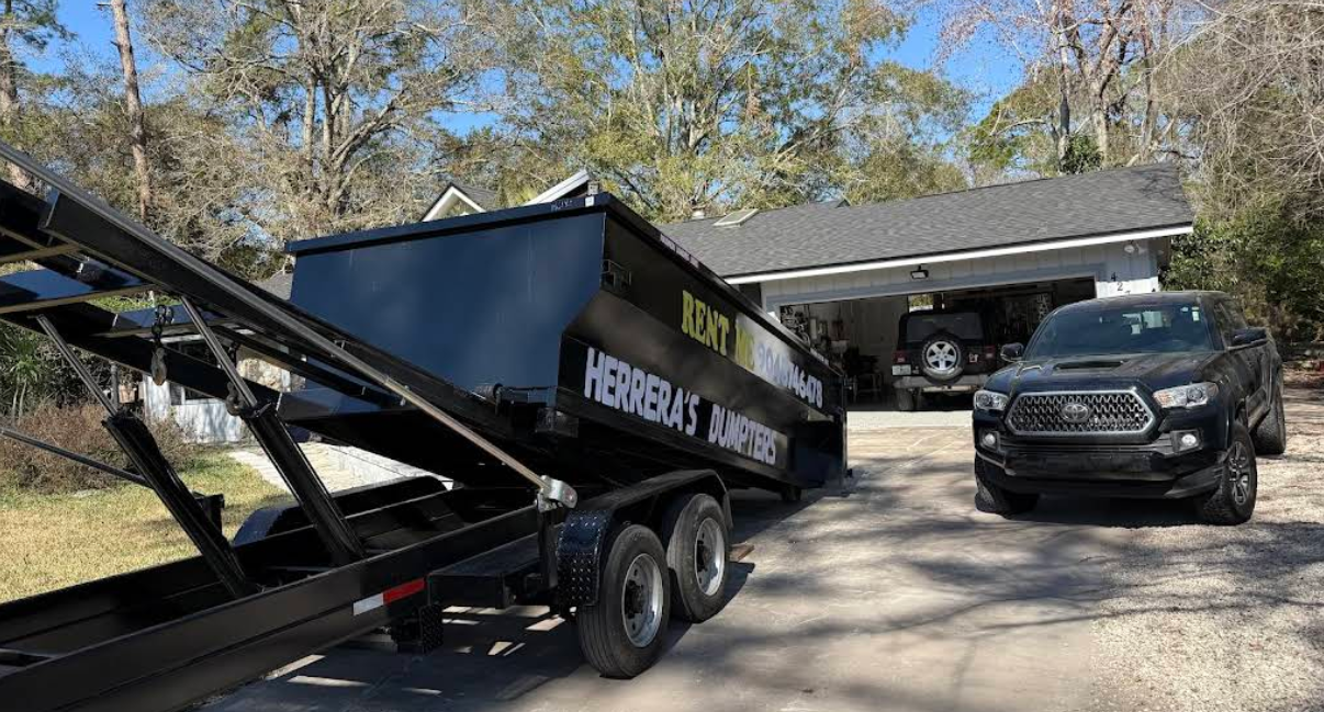 Dump trailer parked near garage